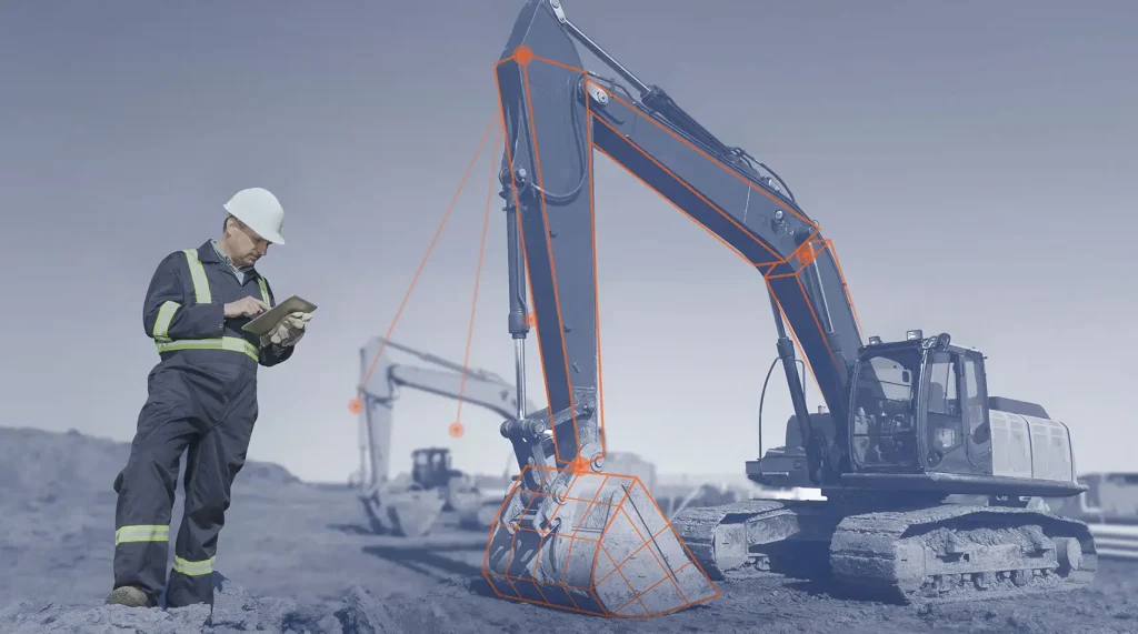 Ein Mitarbeiter einer Baufirma steht vor einer Arbeitsmaschine, die digital mit dem Tablet in seiner Hand vernetzt ist.